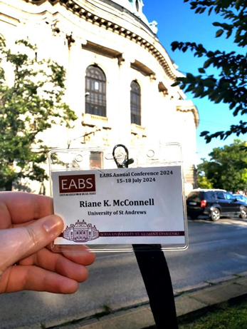 Name tag in front of building